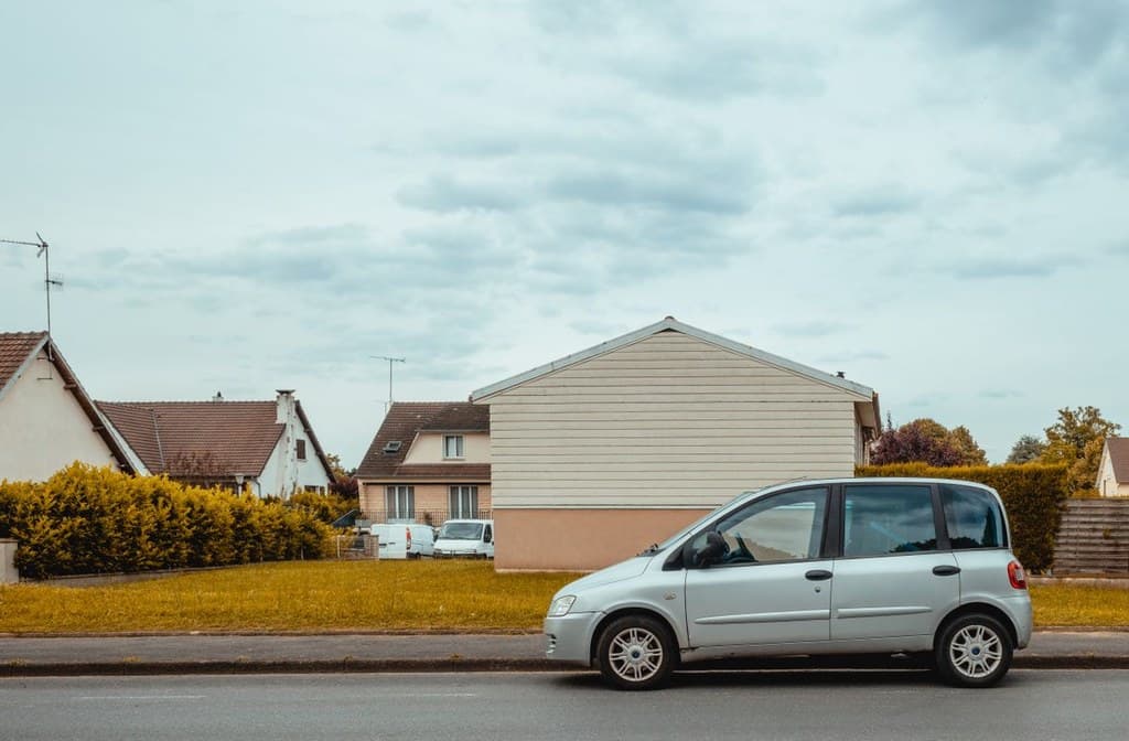 Listing exterior photo before AI scene optimization
